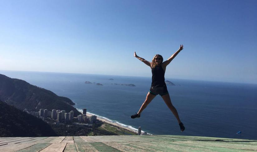 Alana jumping on the beach in Rio