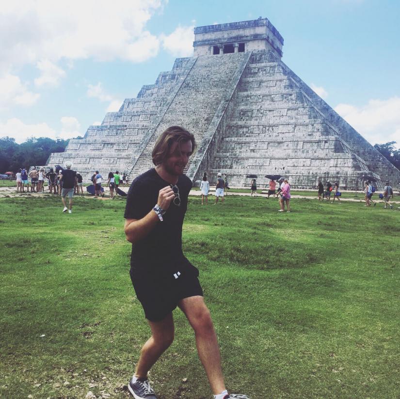 FASS ICS Mexico study tour Mitchell walking in front of an Aztec templo mayor