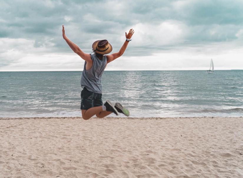 FASS ICS Mexico study tour Mitchell jumping on a beach in Mexico