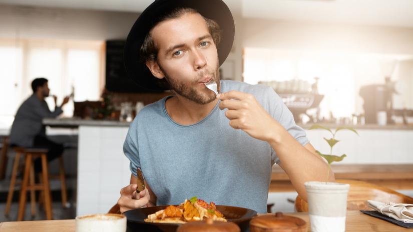 man eating meat