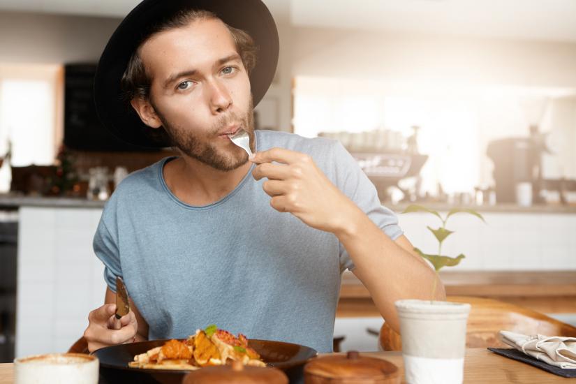 man eating meat