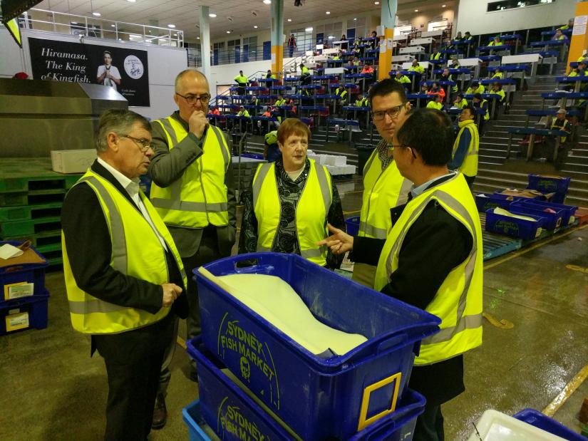 Ren Pin Liu talking with members of Sydney Fish Market