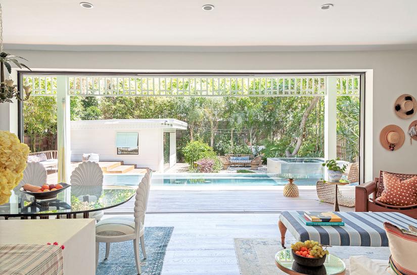 Bright living space looking out to a pool area