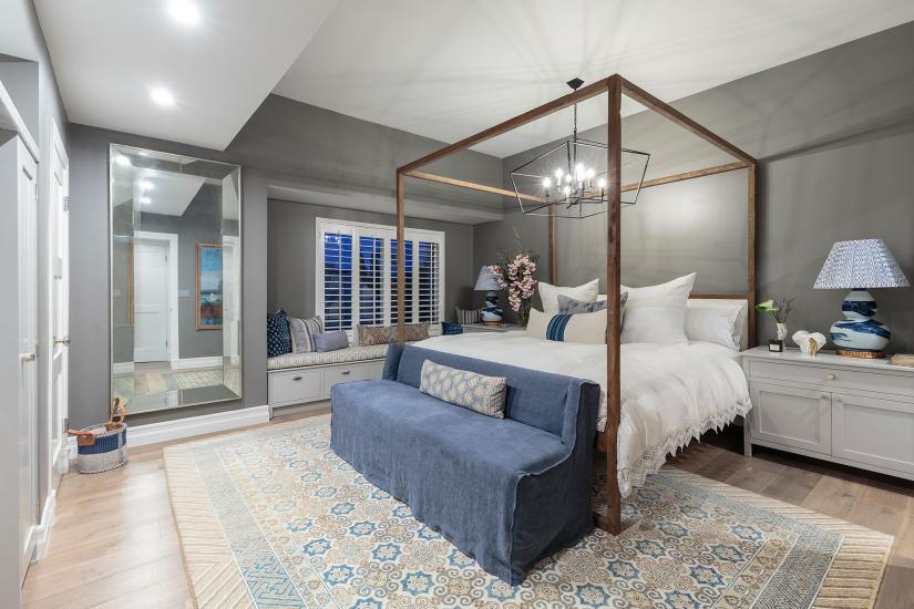 Bedroom interior designed with blues, greys and neutrals