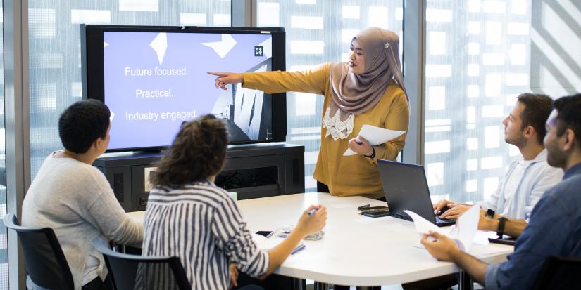 Students learning about the practice program