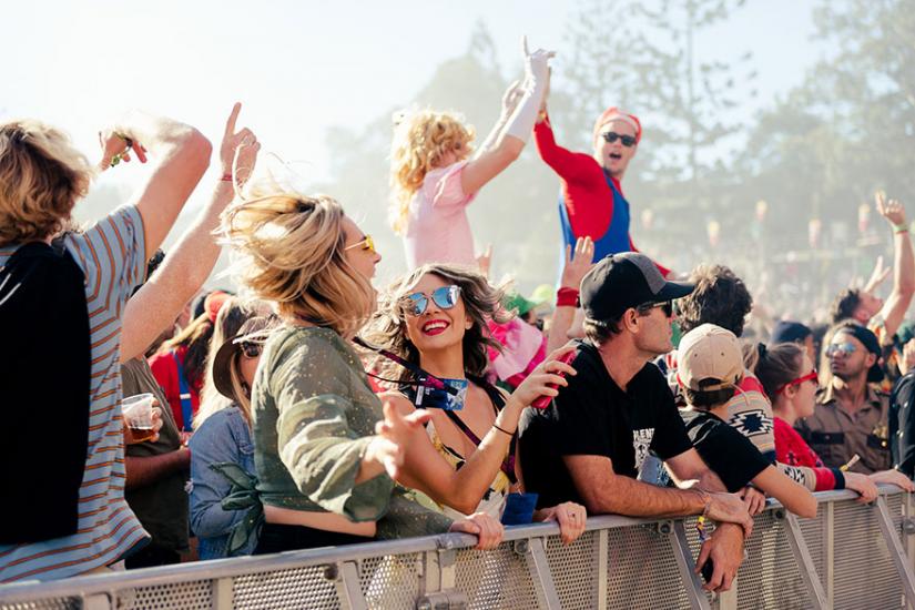 Young people dancing at concert