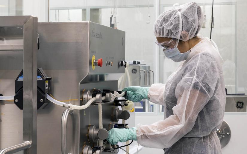 Scientist works with equipment in the UTS biologics innovation facility.