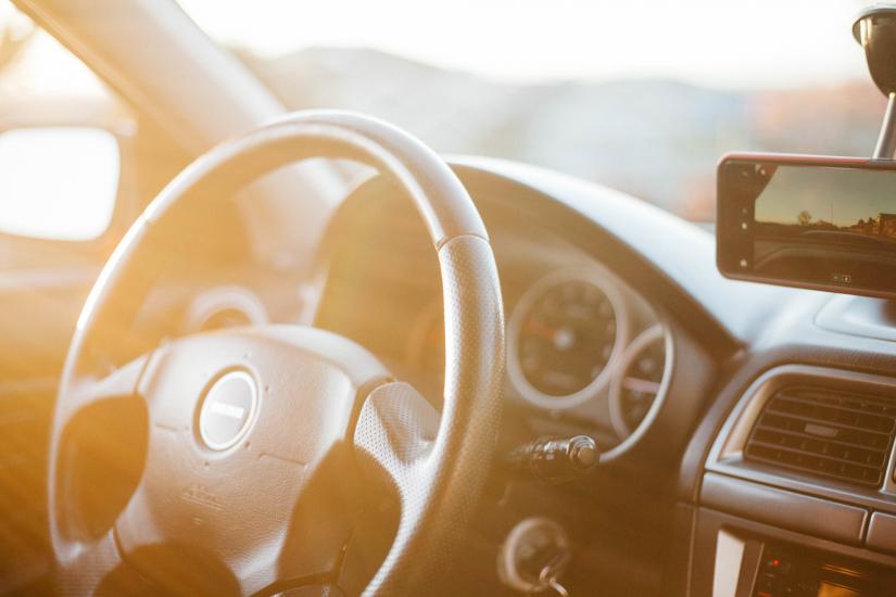 closeup photo of black car steering wheel