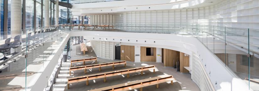 The Reading Room in the newly-opened UTS Central, featuring large glass windows, rows of desks along a wall of books.