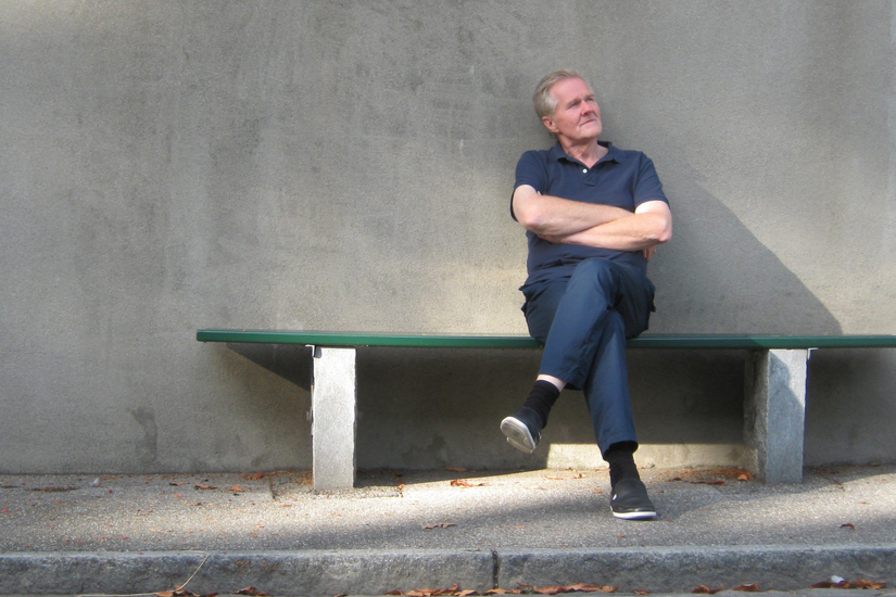 Contemplative man sitting on a bench