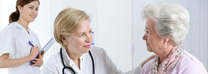 Image of female doctor and pharmacist with elderly patient 