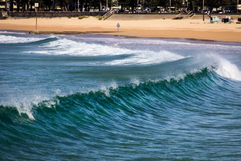 Waves cresting as they approach the beach