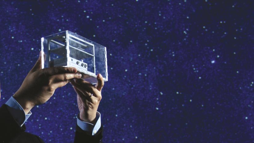 Joshua Chou holding the prototype microgravity device 