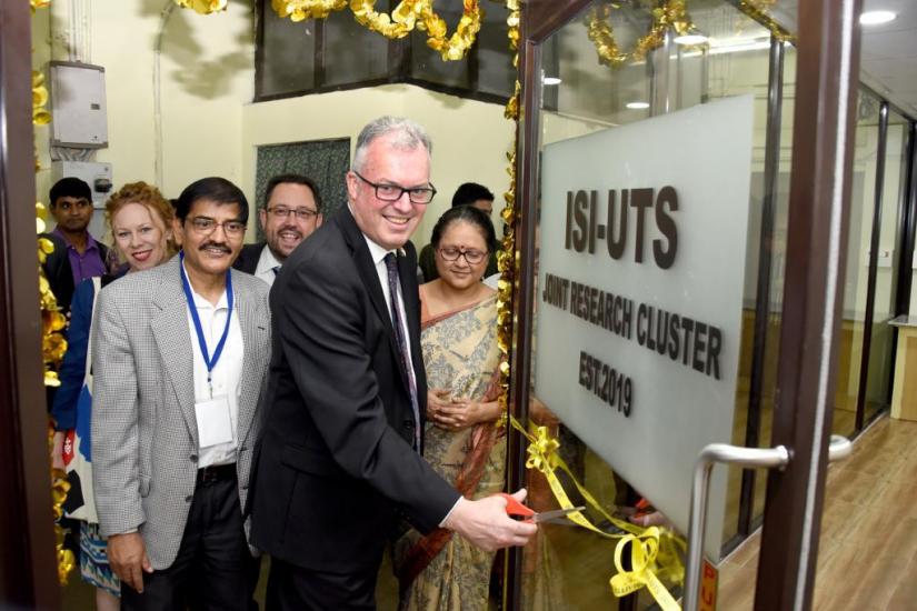 A man cuts a ribbon