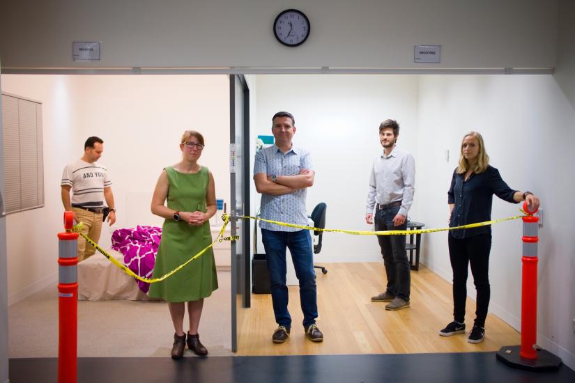 Dr Mark Barash, Dr Xanthe Spindler, Professor Claude Roux, Dr Sebastian Moret, and Dr Maiken Ueland posing in a fake crime scene