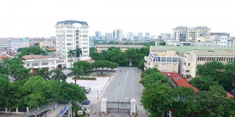 A tree-lined avenue in front of a building