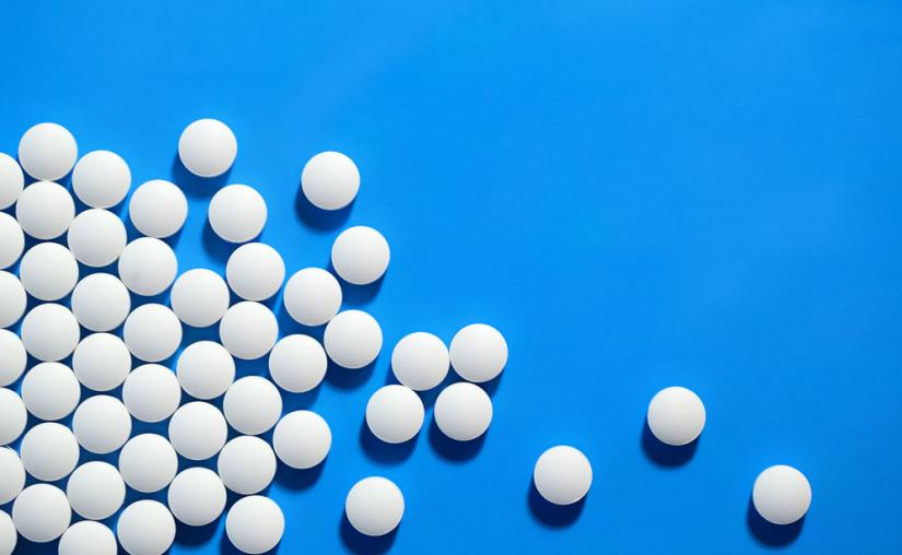 white pills on a blue background