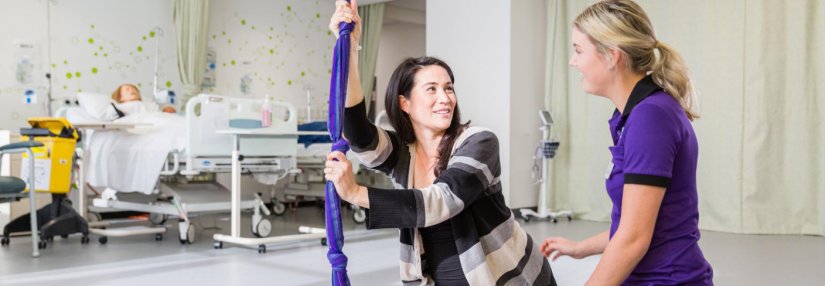 UTS Midwifery student comforts pregnant woman in the UTS Midwifery lab