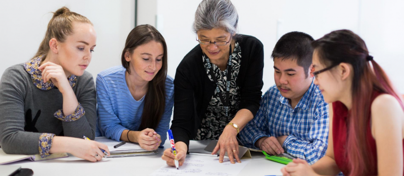 Lecturer and students collaborating