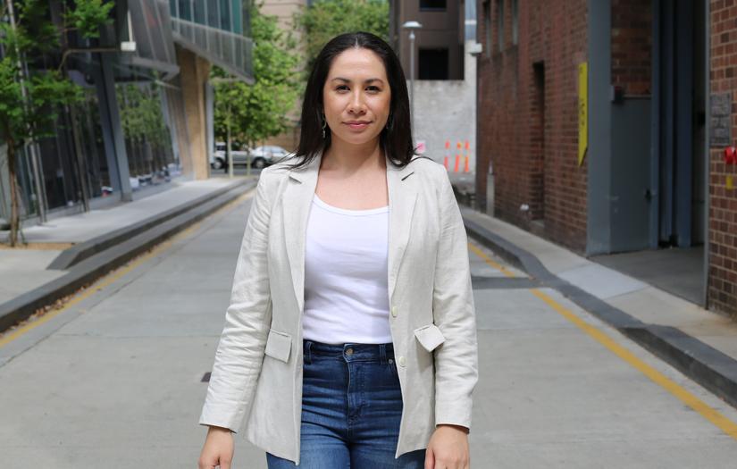 Young women walking towards the camera in a laneway