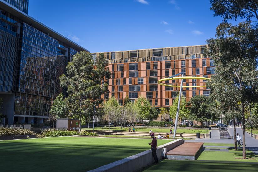 Green grassed area with buildings surrounding