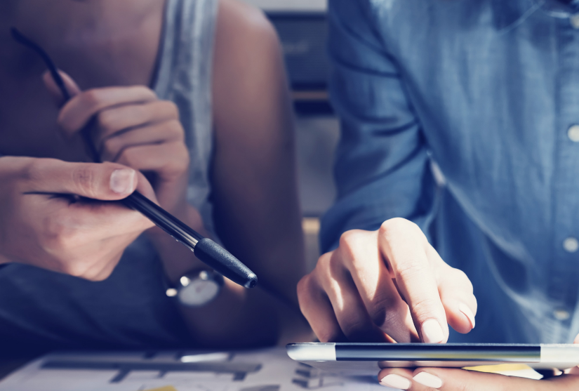 Two women discussing research