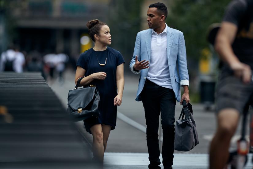 Two UTS postgrad students walking in between campus buildings