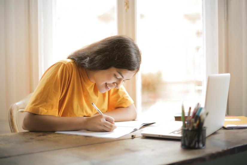 Student working on a budget. Photo by Andrea Piacquadio from Pexels.