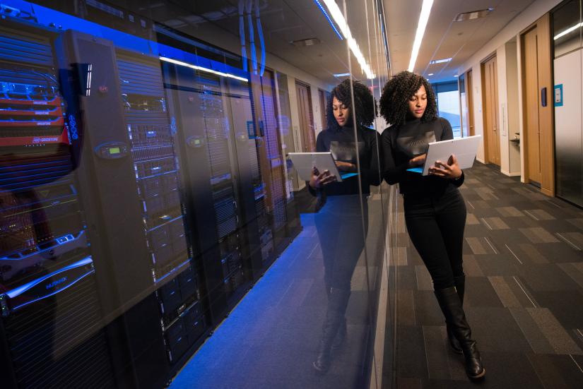 Woman typing on iPad.