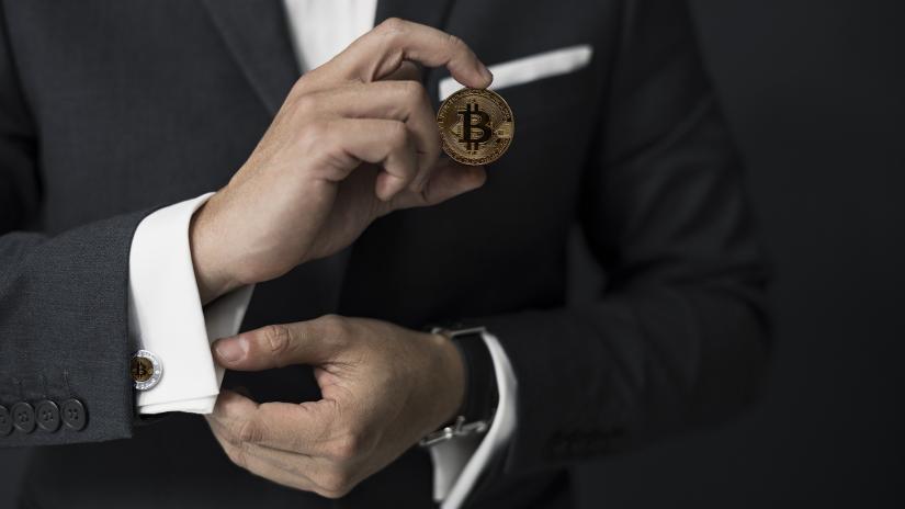 Man holding bitcoin