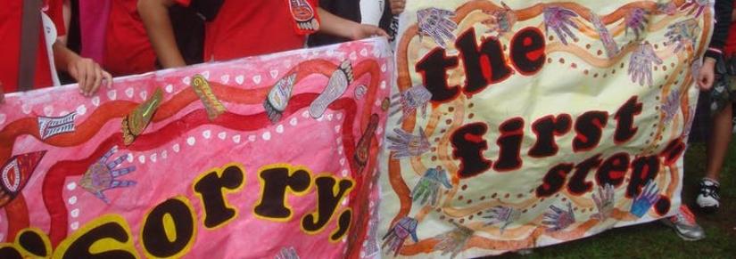 Banners held by Indigenous children