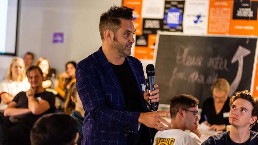 Partner speaking to a class