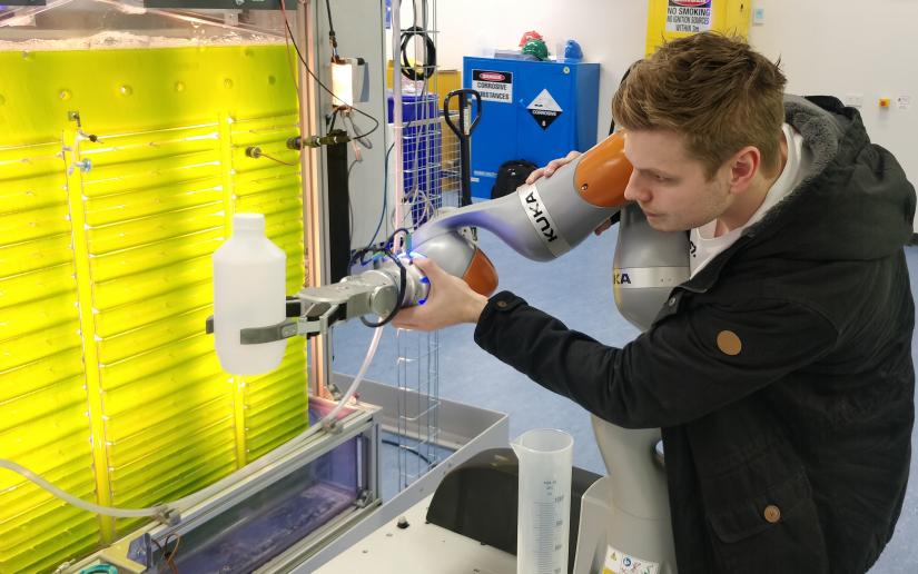 a student navigates a cobot at UTS Tech Lab