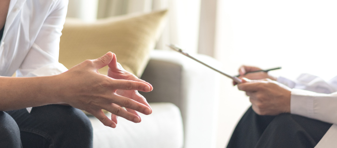 A patient sitting with a therapist