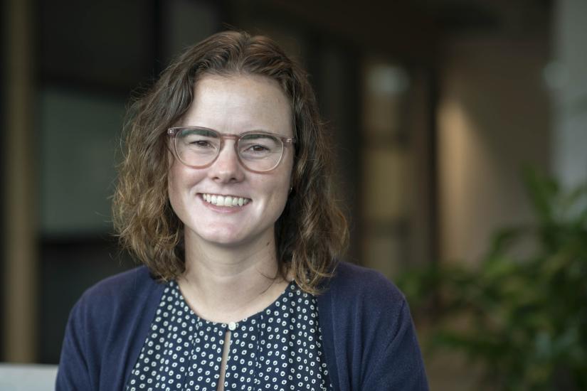 A portrait of a woman smiling at the camera