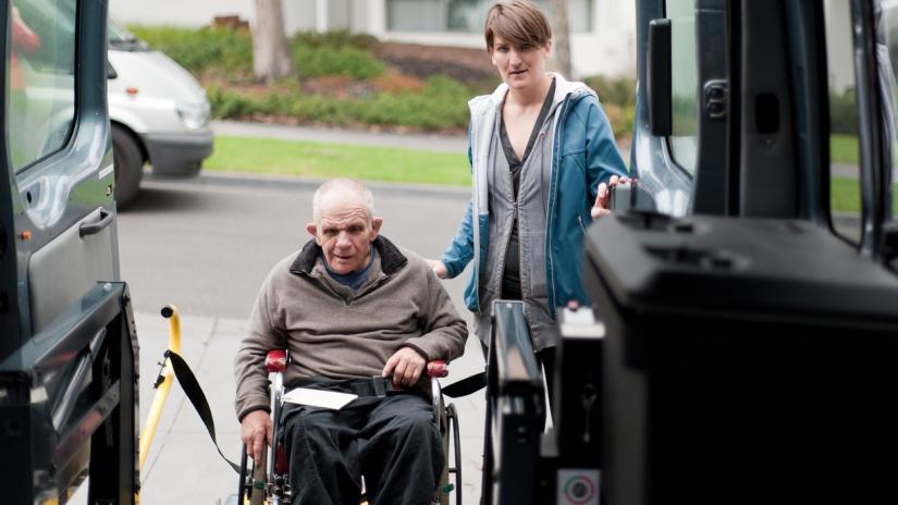 man in a wheelchair takes community transport