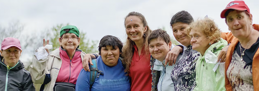 a group of people smile at the camera