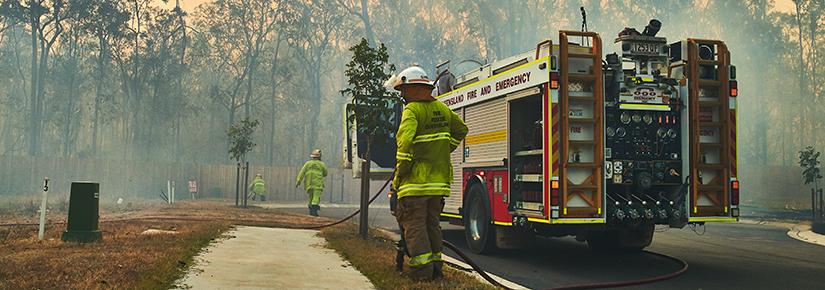 A fire crew in a bushfire affected suburban area