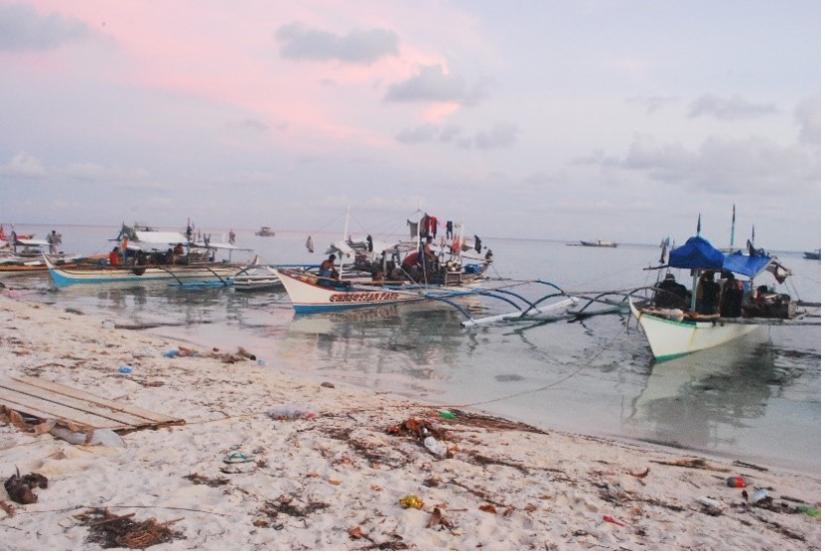 Fishing boats pulling up on the beach