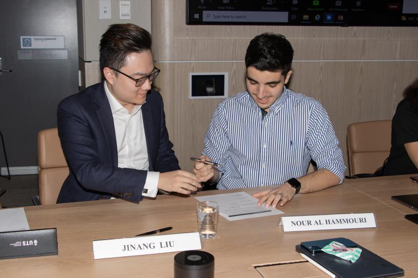 Jin Liu and Nour Al Hammouri signing the Student Partnership Agreement