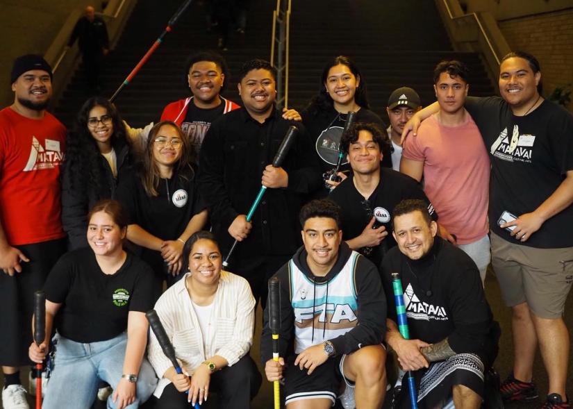 Pacific students with fire dancing instructors