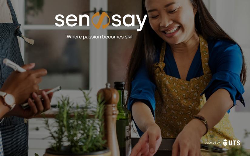 a woman smiles while she attends a sensay class.