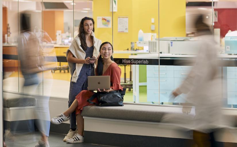 Two students outside the Hive Superlab on UTS campus