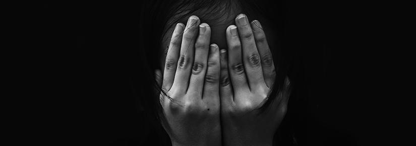 Stock picture of a woman with her head in her hands