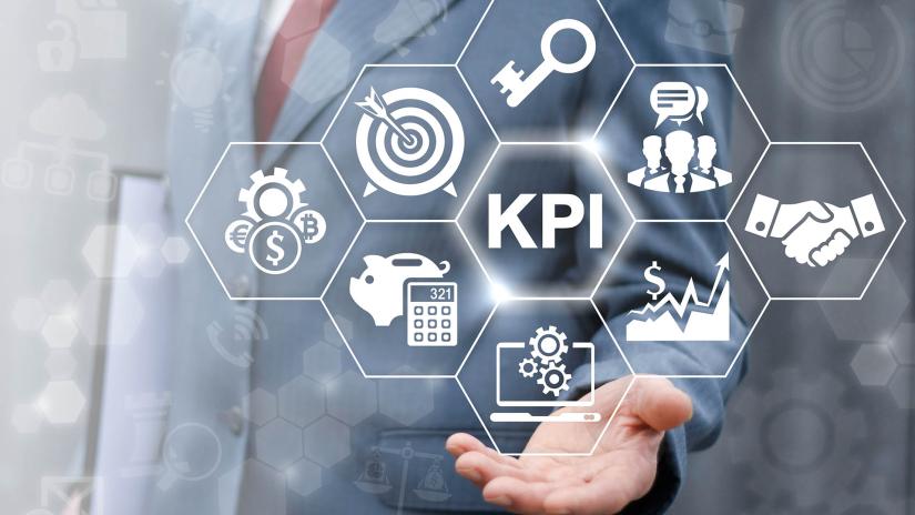 Abstract graphics of KPI, graphs, handshakes and targets with a man in a suit in the background