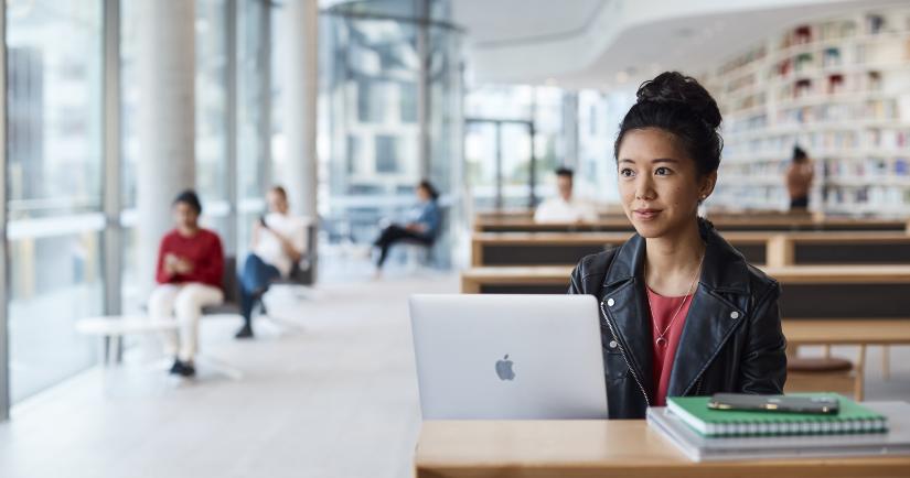 UTS Student looking at laptop in Reading Room