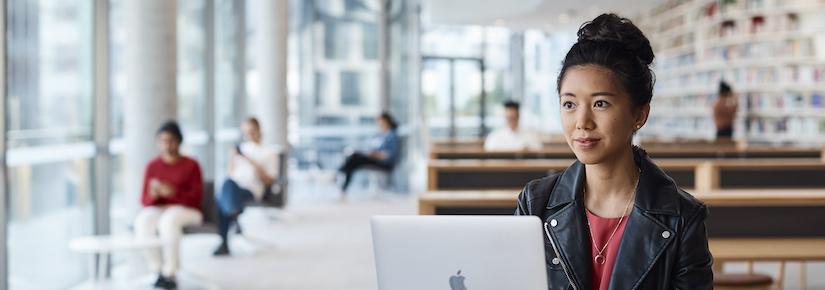 UTS Student looking at laptop in Reading Room