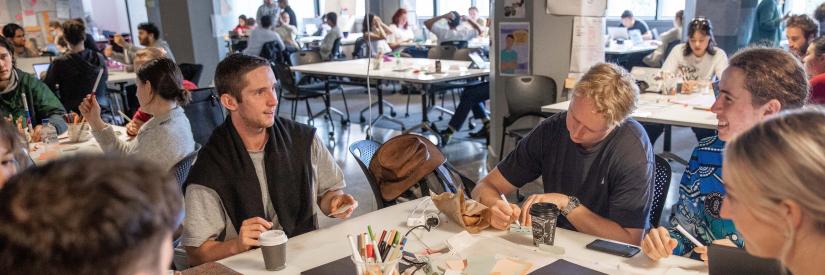 Student team sitting at table collaborating 