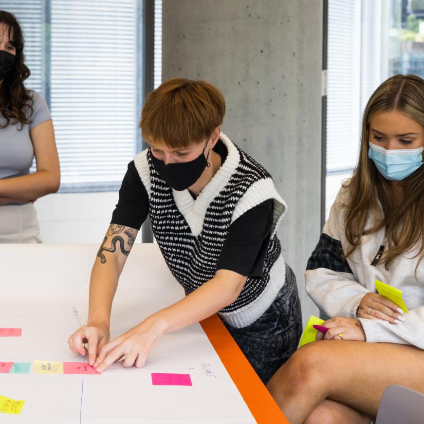 Three people at a workshop