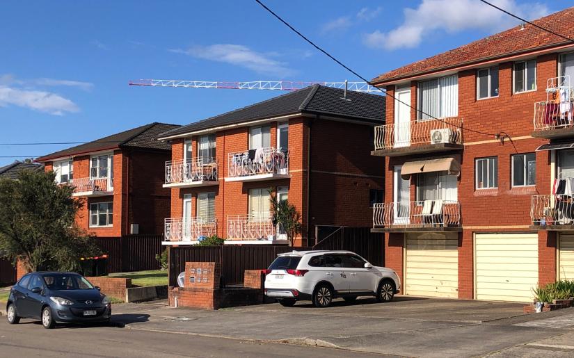 A line of 1960s red brick apartment blocks. Photo: Matthew Darmour-Paul, Author provided